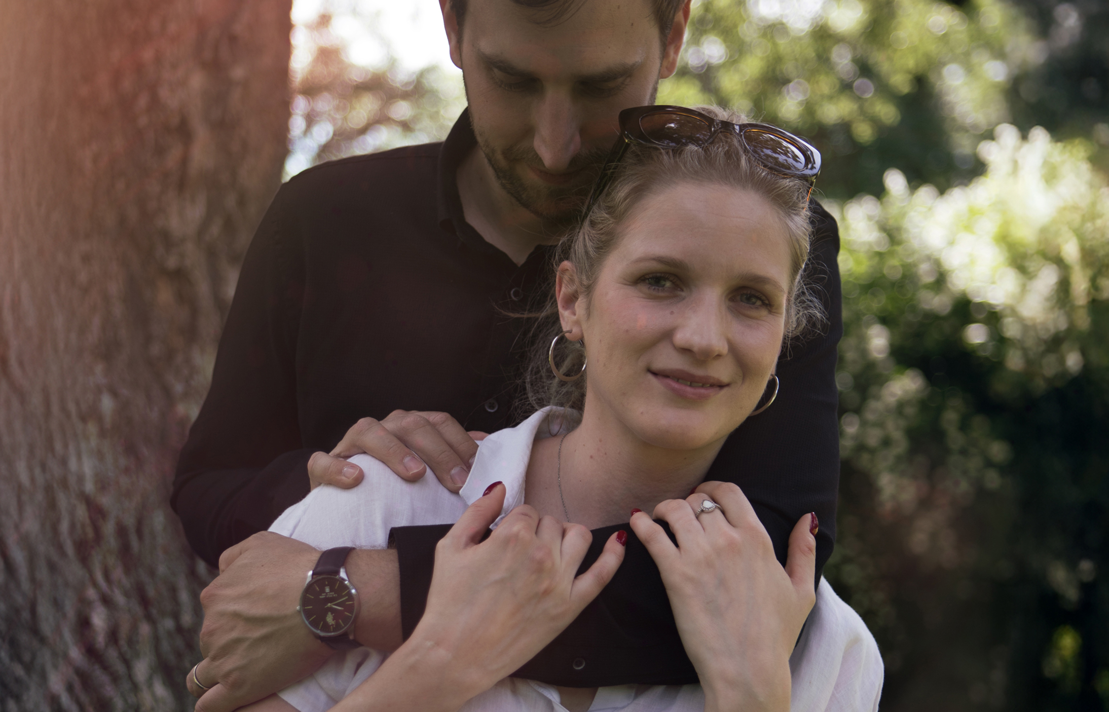 Client wearing a breastmilk ring with zircons, with her husband